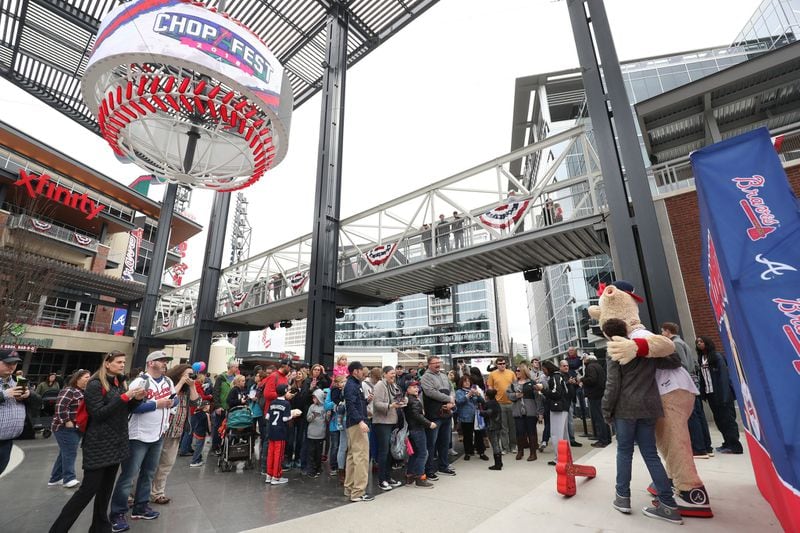 Atlanta Braves mascot Blooper takes photographs with fans at the Plaza at SunTrust Park on January 27, 2018, in Cobb County. (JASON GETZ / AJC)