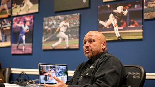 Atlanta Braves manager Fredi Gonzalez talks with members of the media in his office as the players collected their belongings. The Braves' manager defended his moves in the final innings of Game 4 of the NLDS against the Los Angeles Dodgers.