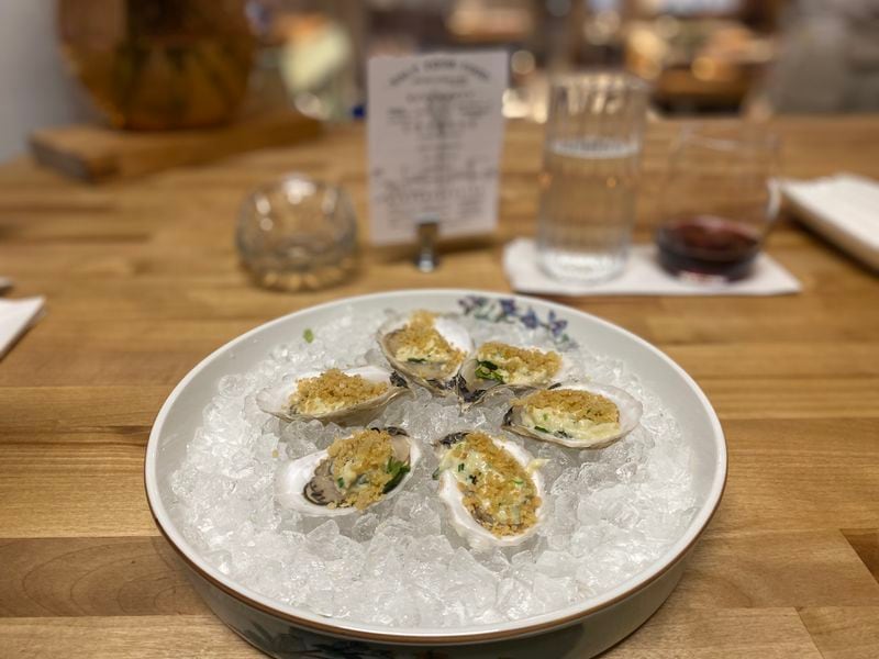 Bovino After Dark offers an optional oyster course at the start of its meals. Pictured are a half-dozen raw Maine oysters with warm crab cream and crispy breadcrumbs. Ligaya Figueras/lfigueras@ajc.com