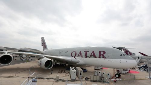 An Airbus SAS A380 aircraft, operated by Qatar Airways Ltd., stands on display on the opening day of the 51st International Paris Air Show in Paris, France, on Monday, June 15, 2015. The 51st International Paris Air Show is the world's largest aviation and space industry exhibition and takes place at Le Bourget airport June 15 - 21. Photographer: Jason Alden/Bloomberg