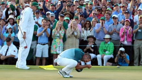 An emotional Sergio Garcia celebrates after winning the Masters in a one-hole playoff Sunday over Justin Rose at Augusta National Golf Club. It was the first major win in Garcia’s 74th attempt. (Curtis Compton/ccompton@ajc.com)