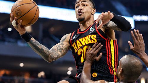 Hawks forward John Collins is seeking a second opinion on his right ring finger sprain and right foot strain. (AP Photo/Jeffrey Phelps)