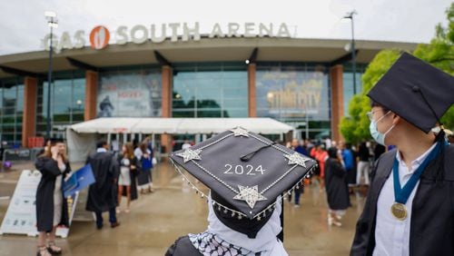 Graduates are seen leaving the Gas South Arena during Emory University's 179th Commencement ceremony at Gas South Arena on Monday, May 13, 2024, in Duluth. The school has seen many protests in support of Palestinians, and leaders pivoted to having commencement at Gas South because of safety concerns.
(Miguel Martinez / AJC)