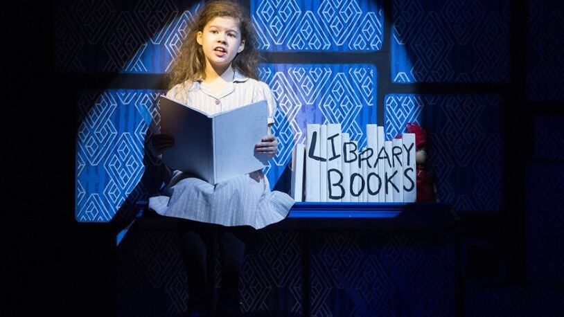 Jaime MacLean performs as Matilda. A touring version of the hit musical “Matilda,” about a precocious girl who leads a rebellion against her brutish headmistress, arrives at the Fox Theatre from April 18-23. CONTRIBUTED BY CYLLA VON TIEDEMANN For the AJC