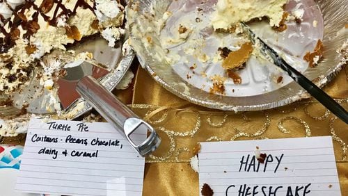 The aptly named Happy Cheesecake was a crowd-pleaser at this year’s AJC staff potluck. LIGAYA FIGUERAS/LFIGUERAS@AJC.COM
