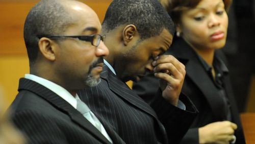 Devonni Manuel Benton (center) reacts as Superior Court Judge T. Jackson Bedford addresses the jury during his trial in 2009. Benton was found guilty of murdering Jasmine Lynn and sentenced to life in prison. HYOSUB SHIN / HSHIN@AJC.COM