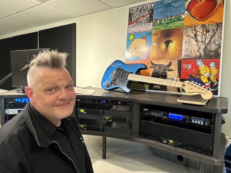 Will Pendarvis dug up 99X memorabilia from the Cumulus storage room to decorate the studio, which had formerly been home to Rock 100.5 until December, 2022. This photo was taken May 4, 2023. RODNEY HO/rho@ajc.com