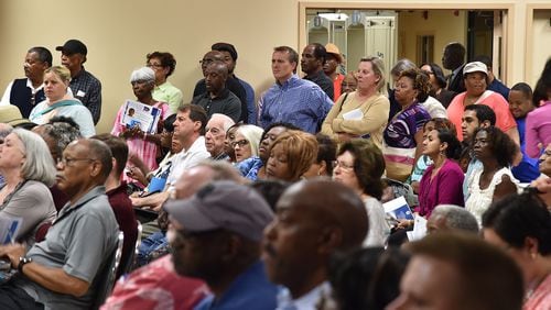 Hundreds of DeKalb County residents filled the Maloof Auditorium to a standing room only capacity Oct. 6, seeking answers to high water bills. BRANT SANDERLIN/BSANDERLIN@AJC.COM