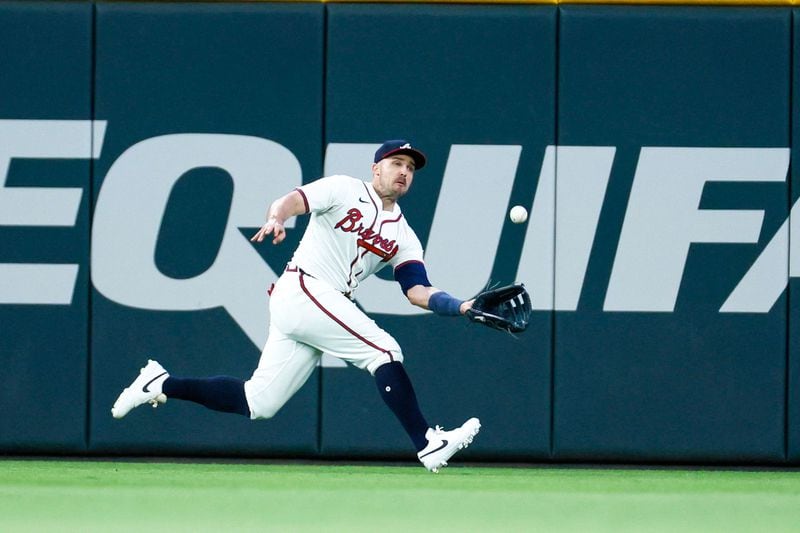 Atlanta Braves outfielder Adam Duvall makes a catch from Red Sox outfielder Tyler O'Neill  during the seventh inning at Truist Park on Tuesday, May 7, 2024. (Miguel Martinez/ AJC)