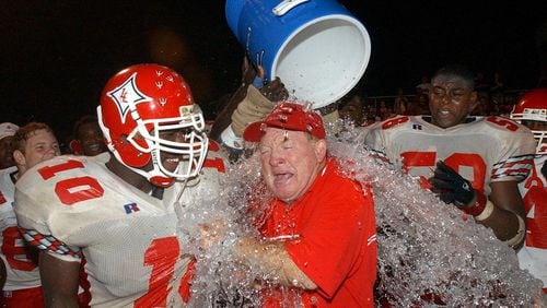 Lincoln County football coach Larry Campbell celebrates a victory on Oct. 11, 2002. (CURTIS COMPTON/staff)