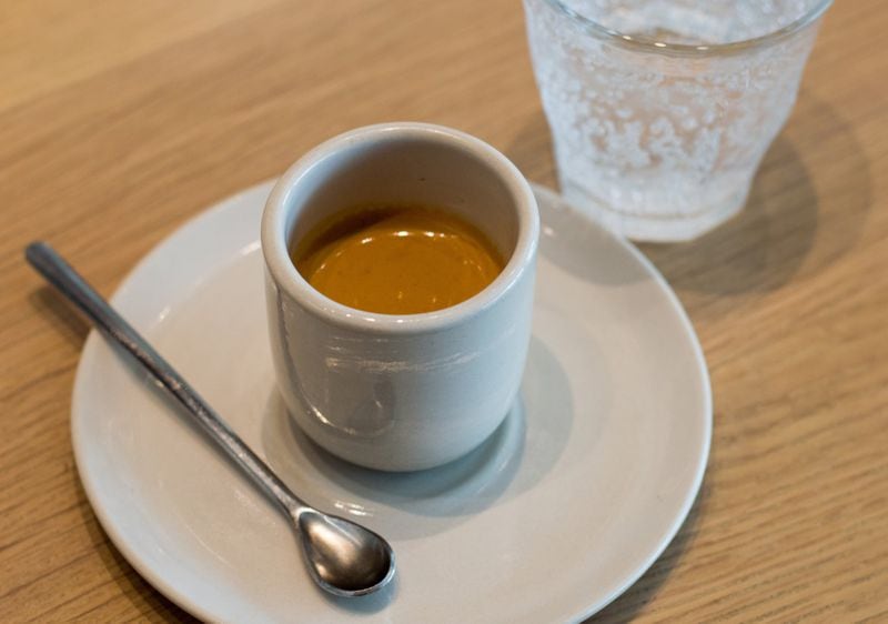 A simple espresso at Revelator in West Midtown, served with sparkling water to cleanse the palate. CONTRIBUTED BY HENRI HOLLIS