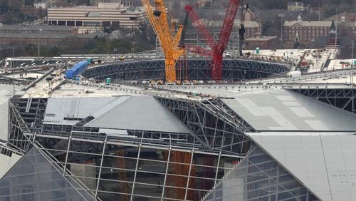 January 10, 2017, Atlanta: The progress of the new Falcons Mercedes-Benz Stadium is seen with cranes rising from the floor through the retractable roof on Tuesday, Jan. 10, 2017, in Atlanta. Curtis Compton/ccompton@ajc.com