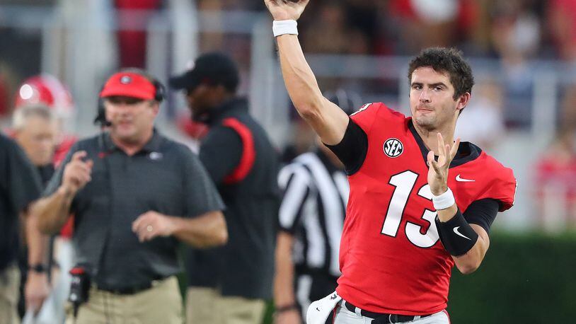 Georgia quarterback Stetson Bennett prepares to come in the game for a series against South Carolina with Kirby Smart looking on during the first quarter in a NCAA college football game on Saturday, Sept 18, 2021, in Athens.    “Curtis Compton / Curtis.Compton@ajc.com”