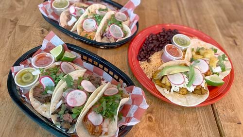 Dos Burros offers 10 tacos, each priced at $5. The $15 taco special brings a choice of two tacos with black or refried beans and Mexican rice. Ligaya Figueras/ligaya.figueras@ajc.com