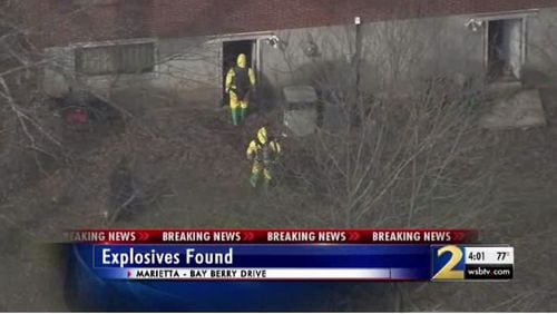 Authorities found pipe bombs and other weapons in the house.