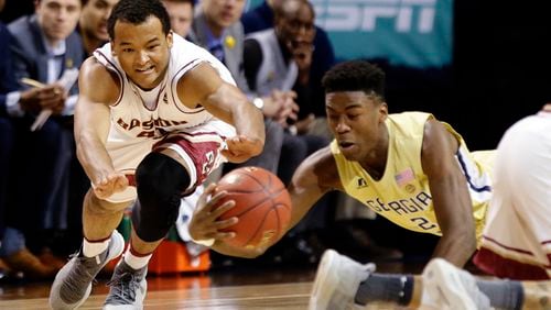 Georgia Tech's Moses Wright (12) and Boston College's Steffon Mitchell (41) fight for control of the ball during the first half of an NCAA college basketball game in the first round of the Atlantic Coast Conference tournament Tuesday, March 6, 2018, in New York. (AP Photo/Frank Franklin II)