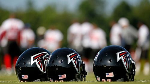 Helmets sit on the ground during the Atlanta Falcons workout on opening day of training camp on July 30, 2010, at the Falcons Training Complex in Flowery Branch.