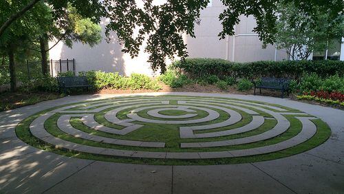 A labyrinth invites visitors and patients near the entrance to Emory University Hospital at Midtown. The hospital has a number of quirky spaces for quiet reflection, including a giant sculptural wind chime and two aviaries. When it comes to designing Atlanta's hospitals and care centers, administrators know that environment matters. (PETE CORSON / pcorson@ajc.com)