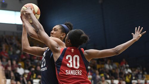Atlanta Dream forward Monique Billings (25) is fouled by Washington Mystics forward LaToya Sanders (30) during the first half of Game 4 of a WNBA basketball playoffs semifinal Sunday, Sept. 2, 2018, in Washington.