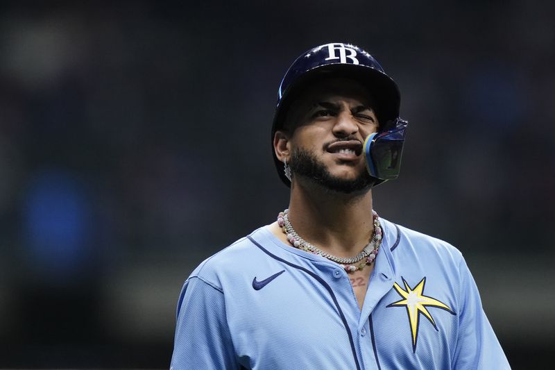 Tampa Bay Rays' Jose Siri reacts after being hit by a pitch during the sixth inning of a baseball game against the Milwaukee Brewers Tuesday, April 30, 2024, in Milwaukee. (AP Photo/Aaron Gash)