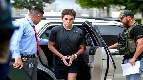 Austin Harrouff is transported by detectives to the Martin County Jail from St. Mary’s Hospital on Monday, Oct. 3, 2016. Harrouff, who allegedly fatally stabbed a Martin County couple. (Richard Graulich / The Palm Beach Post)
