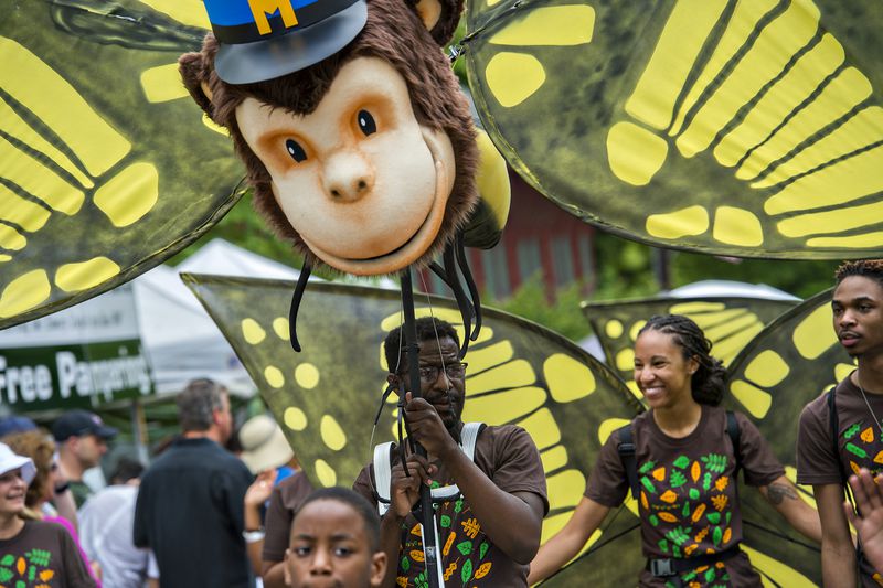 April 25, 2015 Atlanta - Raymond Carr (center) and Alexis Burton participate in the parade during the Inman Park Festival in Atlanta on Saturday, April 25, 2015. The two day festival featured artists, musicians, food, a tour of homes, the parade and activities for children. JONATHAN PHILLIPS / SPECIAL