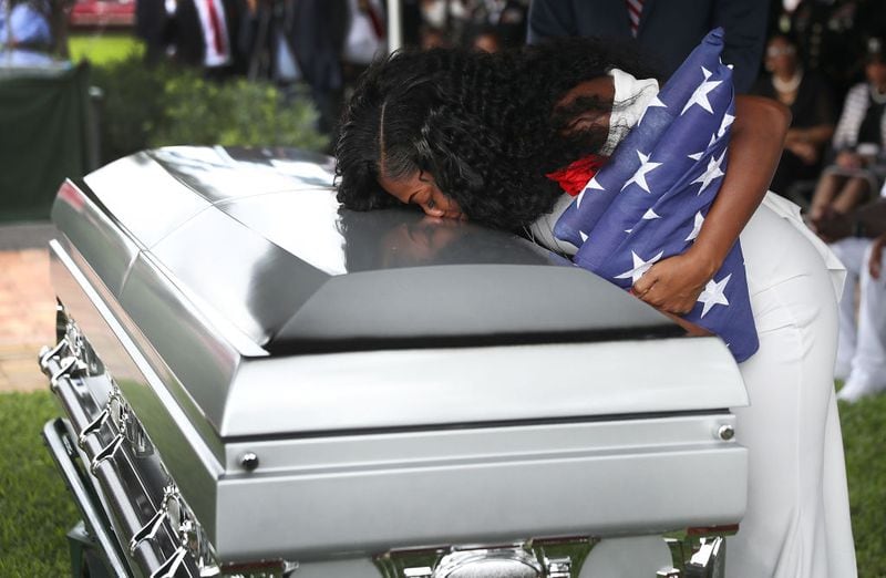 HOLLYWOOD, FL - OCTOBER 21:  Myeshia Johnson kisses the casket of her husband U.S. Army Sgt. La David Johnson during his burial service at the Memorial Gardens East cemetery on October 21, 2017 in Hollywood, Florida. Sgt. Johnson and three other American soldiers were killed in an ambush in Niger on Oct. 4.  (Photo by Joe Raedle/Getty Images)