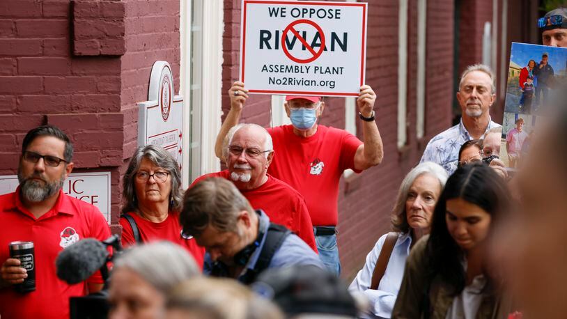 Citizens opposed to the measure gather outside to talk with their attorney, John Christy, after the Morgan County Board of Assessors voted to approve the Rivian tax exemption proposal in Madison on Wednesday, May 25, 2022.   (Bob Andres / robert.andres@ajc.com)