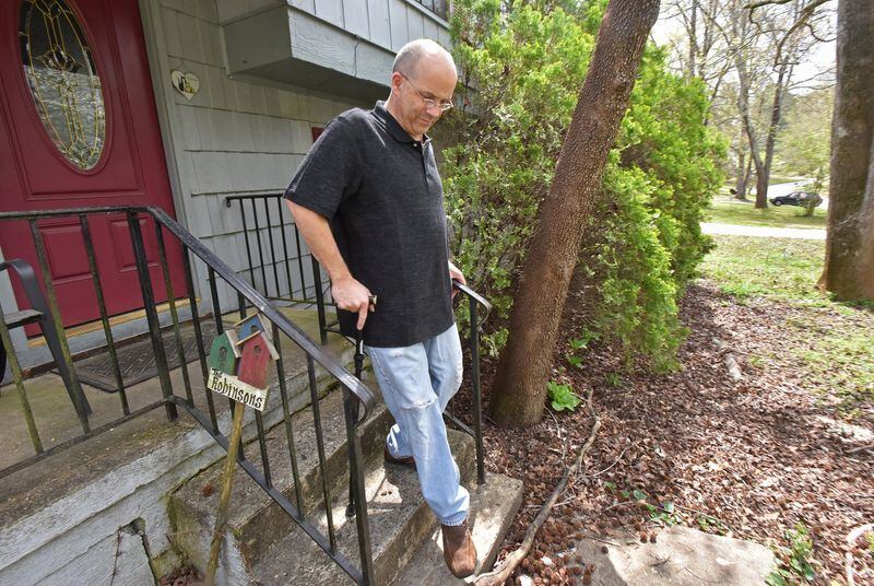 Alan Hause walks in his front yard in Jonesboro. Hause has multiple sclerosis, but after paying $30,000 for an experimental stem cell treatment in India last year, some of his worst symptoms have been reversed. He used to be heavily reliant on a wheelchair, but now he mostly gets about with a cane. He can go to Braves games and church now without a wheelchair. HYOSUB SHIN / HSHIN@AJC.COM