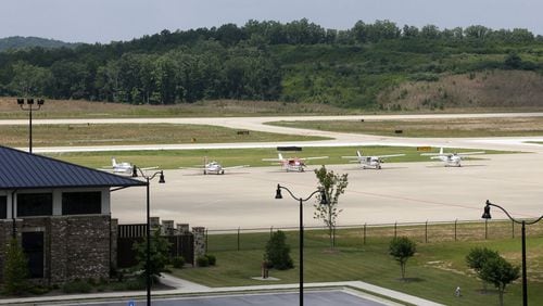 Planes are parked on the tarmac at Paulding’s general aviation airport. BOB ANDRES / BANDRES@AJC.COM