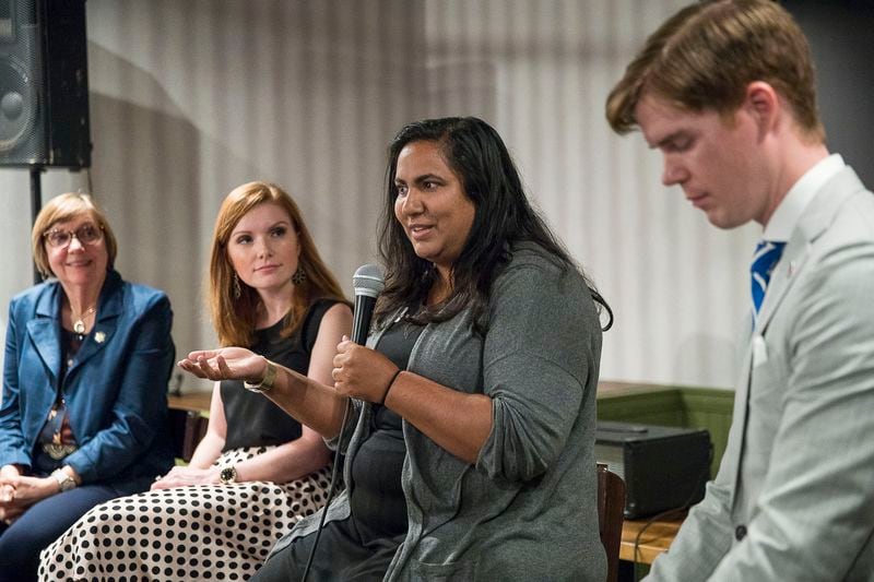 Sunita Theiss (center) speaks on a panel about issues affecting women in Atlanta suburbs during the Atlanta Young Republicans monthly meeting at City Tap in Atlanta, Wednesday, September 25, 2019.   (Alyssa Pointer/alyssa.pointer@ajc.com)