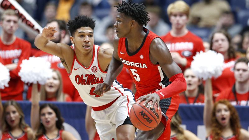 Georgia guard Anthony Edwards (5) drives against Mississippi's Breein Tyree (4) in the second half of their SEC Tournament game Wednesday, March 11, 2020, in Nashville, Tenn. Georgia won 81-63. (Mark HumphreyAP)