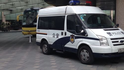 A police vehicle was parked in front of the UCLA team bus at the Hyatt Regency hotel in Hangzhou, China, Tuesday morning.
