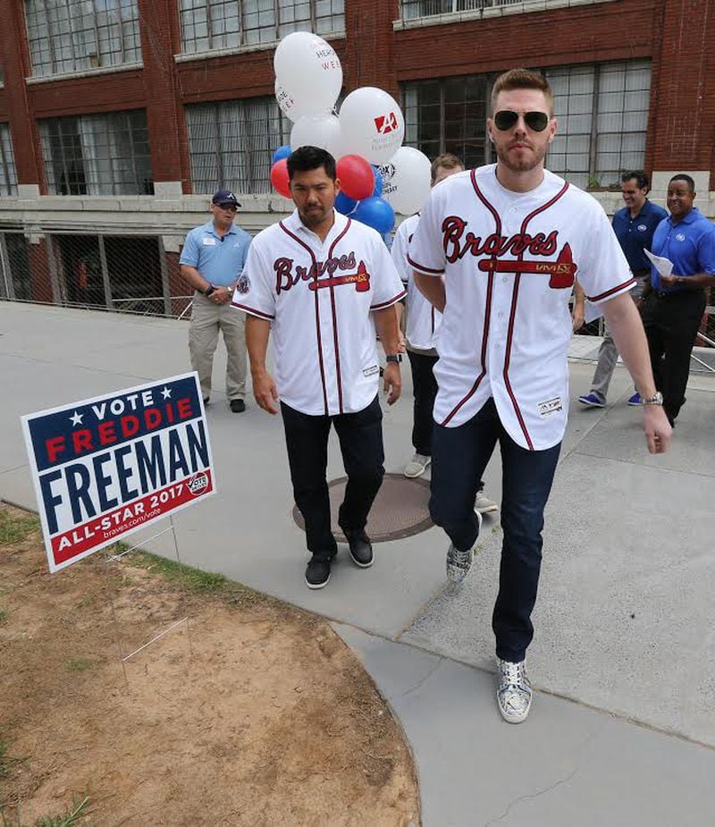 Atlanta Braves players first baseman Freddie Freeman, catcher						Kurt Suzuki arrive at the surprise event. 