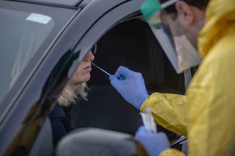FILE -- A drive-through COVID-19 testing site in Jericho, N.Y., on March 18, 2020. Just weeks after resolving shortages in swabs, researchers are struggling to find the chemicals and plastic pieces they need to carry out coronavirus tests in the lab — leading to long waiting times. (Johnny Milano/The New York Times)