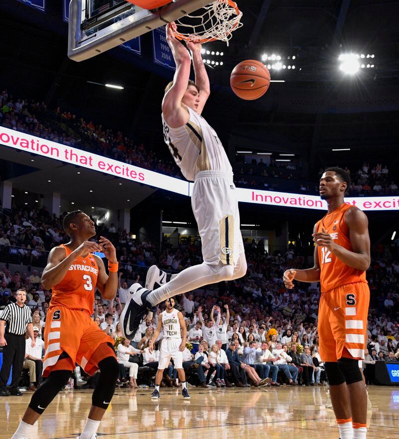  Georgia Tech center Ben Lammers (44) dunks in front of Syracuse guard Andrew White III (3) and forward Taurean Thompson (12) during the second half of an NCAA college basketball game, Sunday, Feb. 19, 2017, in Atlanta. Tech won 71-65. (John Amis/Special to the AJC)