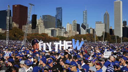 It’s Chicago Cubs fans as far as the eye can see, celebrating during a rally in Grant Park after finally winning the World Series. (AP Photo/Charles Rex Arbogast)