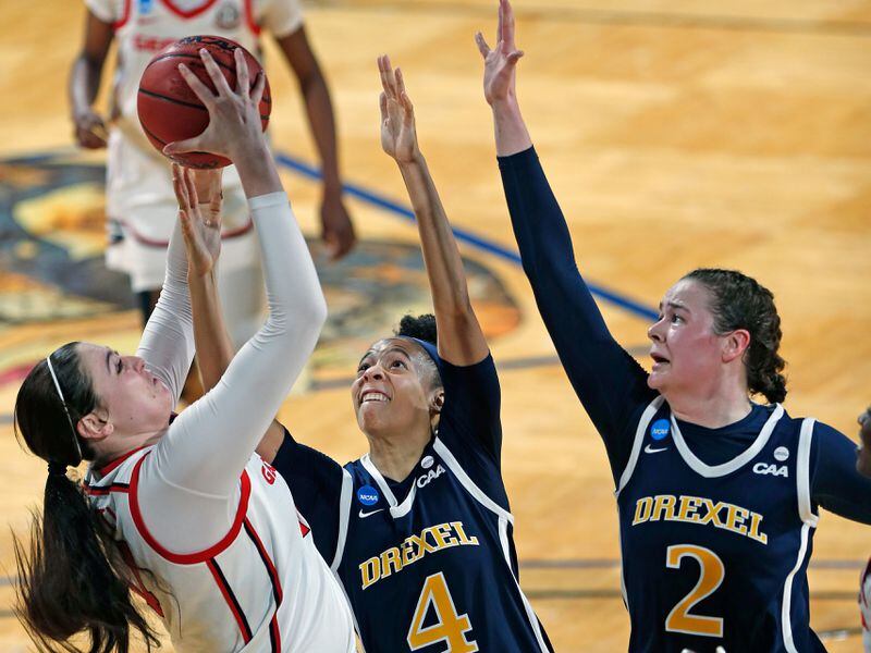 Georgia center Jenna Staiti (14) shoots over Drexel guard Kayla Bacon (4) and forward Hetta Saatman (2) during the second half of their NCAA tournament game Monday, March 22, 2021, at the Greehey Arena in San Antonio, Texas. (Ronald Cortes/AP)