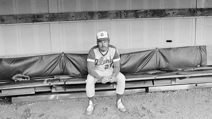 Braves acting manager Ted Turner sits alone in the dugout prior to a game against the Pirates on May 11, 1977, at Three Rivers Stadium in Pittsburgh.