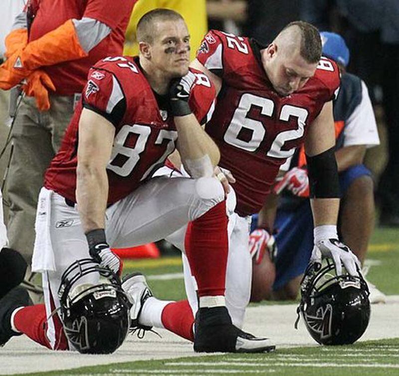 Time runs out for Falcons tight end Justin Peelle (left) and center Todd McClure (right) as they lose 17-14 to the Saints at the Georgia Dome in Atlanta on Monday, Dec. 27, 2010.