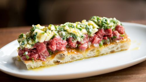 The Deer and the Dove tartare features rare beef, soft boiled gribiche, focaccia and olive oil. CONTRIBUTED BY MIA YAKEL