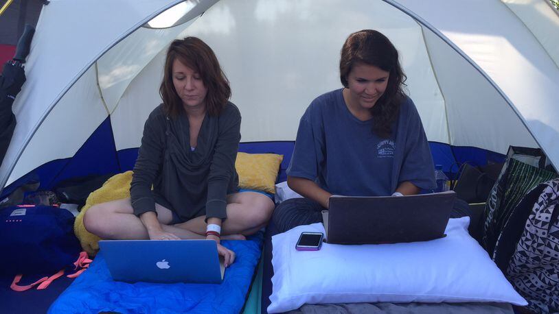 Atlanta residents Jodi Meadows and Shelby Dillon worked from their tent during a contest outside of the Ashford Dunwoody Road Chick-fil-A in 2015. A similar contest is scheduled this week at a new location on Cascade Road.
