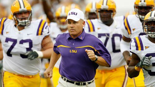 LSU reportedly has fired coach Les Miles and offensive coordinator Cam Cameron, the day following a loss to Auburn. (AP photo)