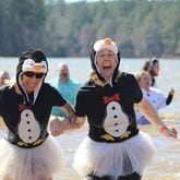 Beth Jefferies and Tamara Pansy brave the icy water of Lake Acworth Saturday. (Courtesy of Aleks Gilbert/Marietta Daily Journal)