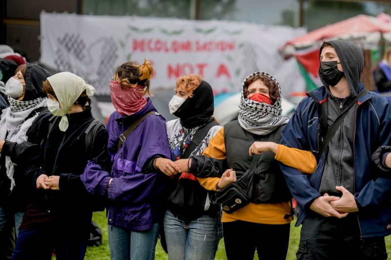 Participants are seen during a pro-Palestinians demonstration by the group "Student Coalition Berlin" in the theater courtyard of the 'Freie Universität Berlin' university in Berlin, Germany, Tuesday, May 7, 2024. Pro-Palestinian activists occupied a courtyard of the Free University in Berlin on Tuesday. (AP Photo/Markus Schreiber)