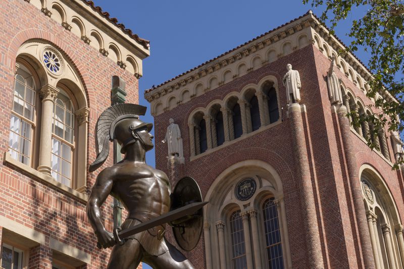 The iconic Tommy Trojan statue stands posed at the University of Southern California campus in Los Angeles, Tuesday, April 16, 2024. University of Southern California officials have canceled a commencement speech by its 2024 valedictorian, a pro-Palestinian Muslim, citing "substantial risks relating to security and disruption" of the event that draws 65,000 people to campus. (AP Photo/Damian Dovarganes)