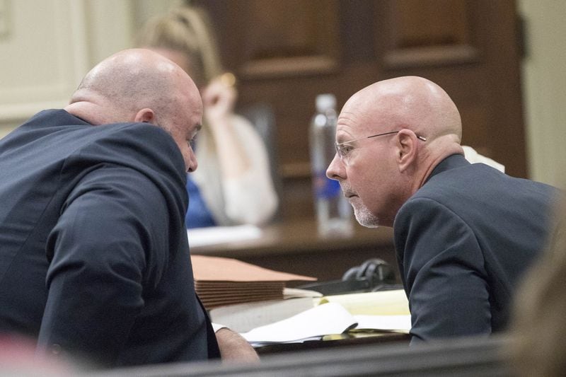 Defense attorneys Scott Johnston (left) and Larkin Lee confer during the murder trial of their client  Franklin Gebhardt at the Spalding County Courthouse in Griffin on June 22, 2018. 
