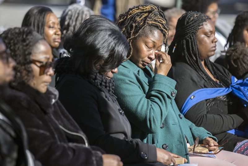 SAVANNAH, GA - FEBRUARY 01, 2024: Breonna Moffett's Aunt Nimba Burgess, center, wipes a tear from her eyes during a ceremony to honor the memory of her neice, Thursday, Feb. 1, 2024, at Windsor Forest High School in Savannah, Ga. Moffett was one of three Georgia solders killed in a drone attack Jan. 28, 2024 in Jordan. (AJC Photo/Stephen B. Morton)