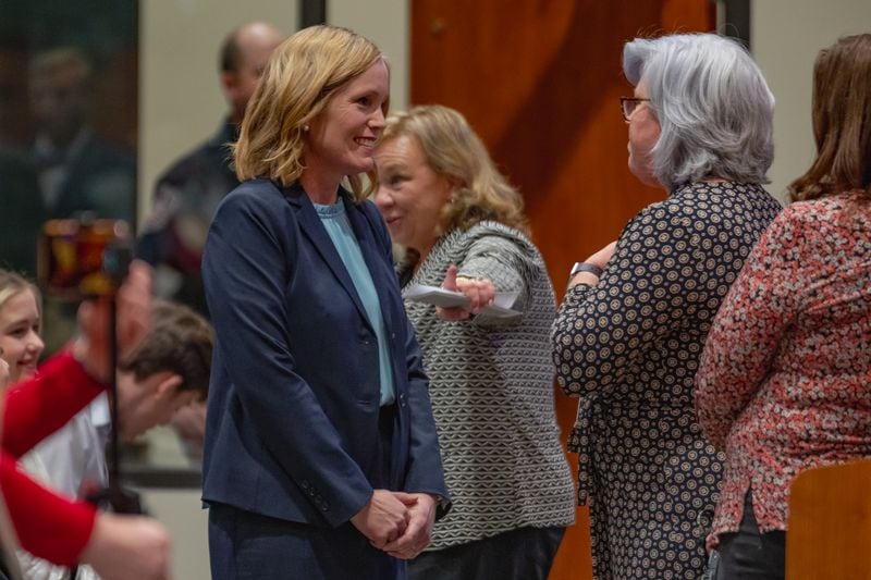 Outgoing Henry County Schools Superintendent Mary Elizabeth Davis speaks with a Cherokee County Schools constituent during the Feb. 15 meeting at which Davis was named the north metro Atlanta school system's top leader. (Jason Allen for The Atlanta Journal-Constitution)