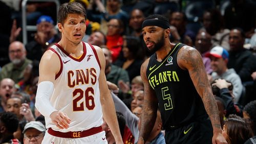 Kyle Korver  of the Cleveland Cavaliers reacts after hitting a three-point basket against Malcolm Delaney of the Atlanta Hawks to end the third quarter at Philips Arena on February 9, 2018 in Atlanta, Georgia.    (Photo by Kevin C. Cox/Getty Images)